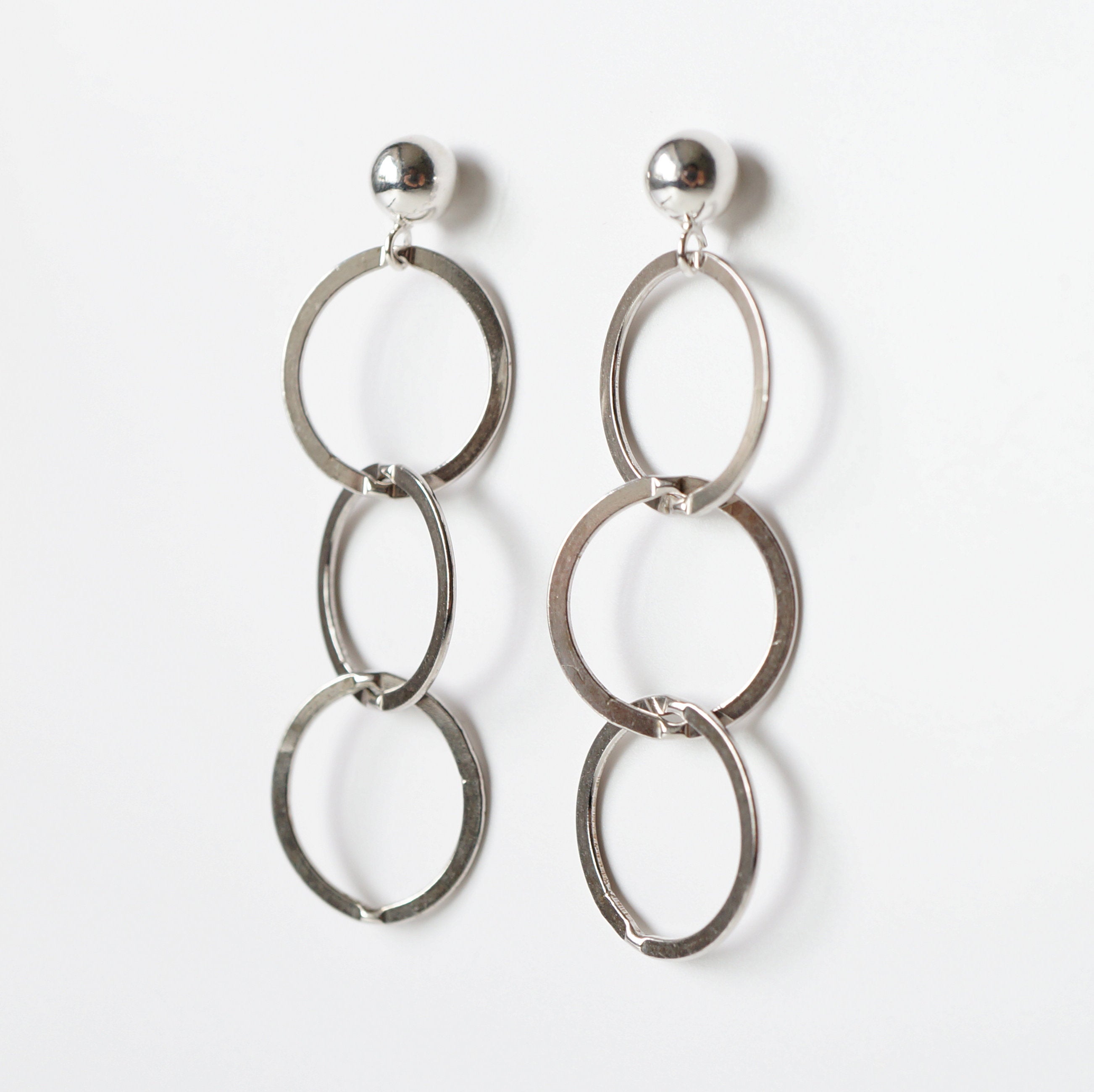 Silver loop earrings on sterling silver studs (Mikos)