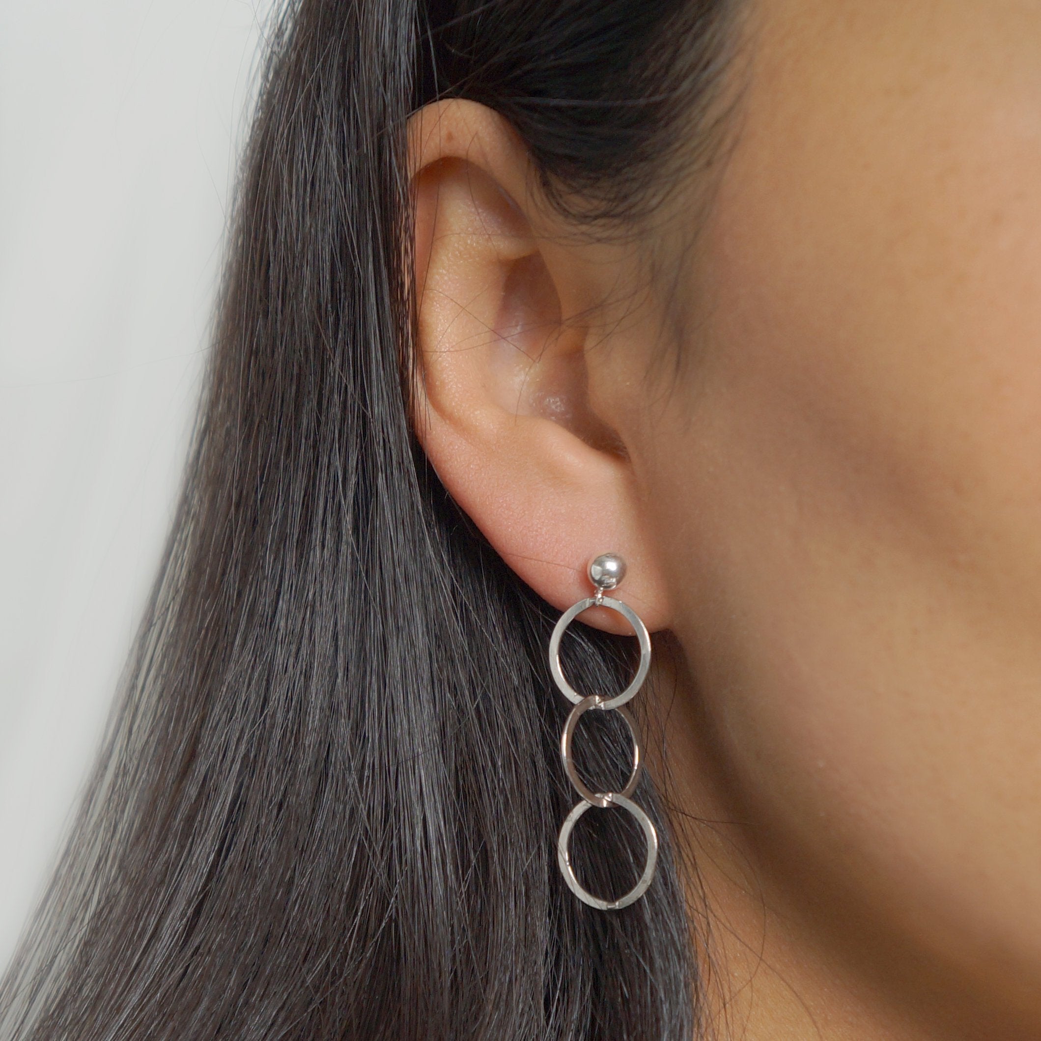 Silver loop earrings on sterling silver studs (Mikos)