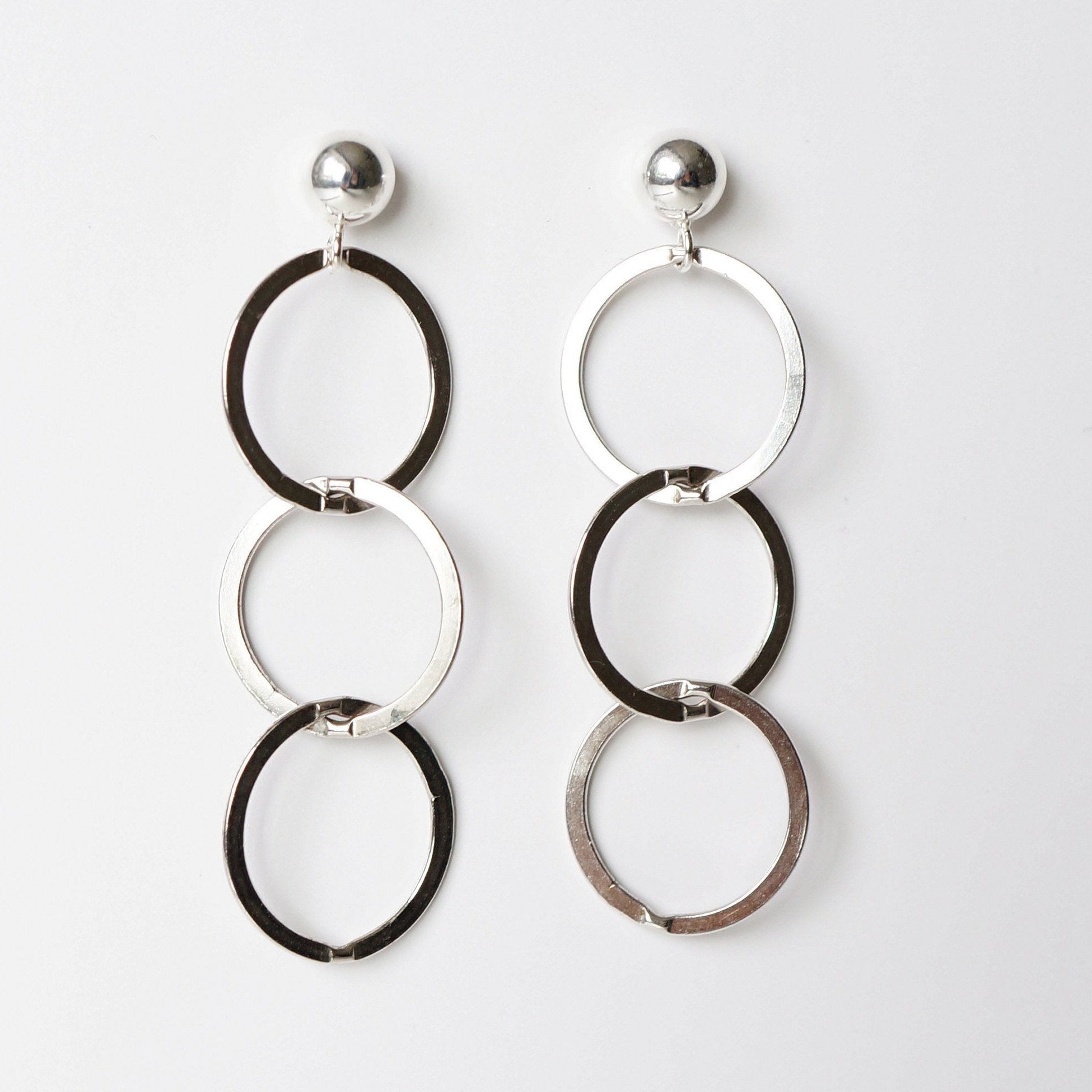 Silver loop earrings on sterling silver studs (Mikos)